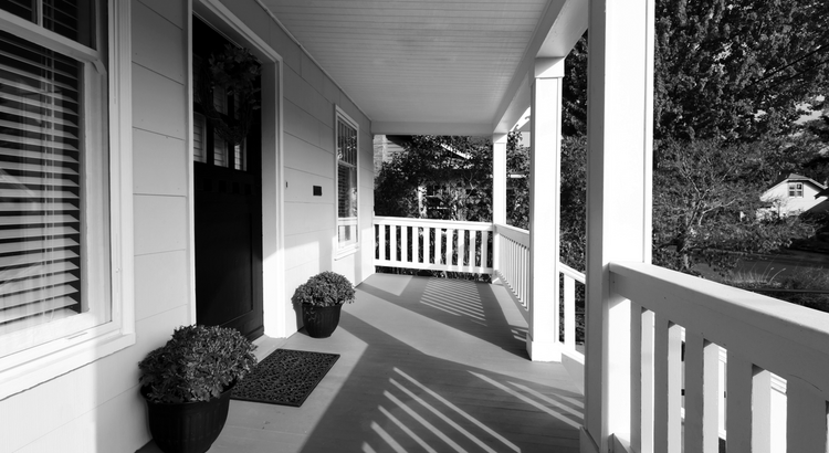 A home inspector reviewing a house with a seller in Tucson, Arizona